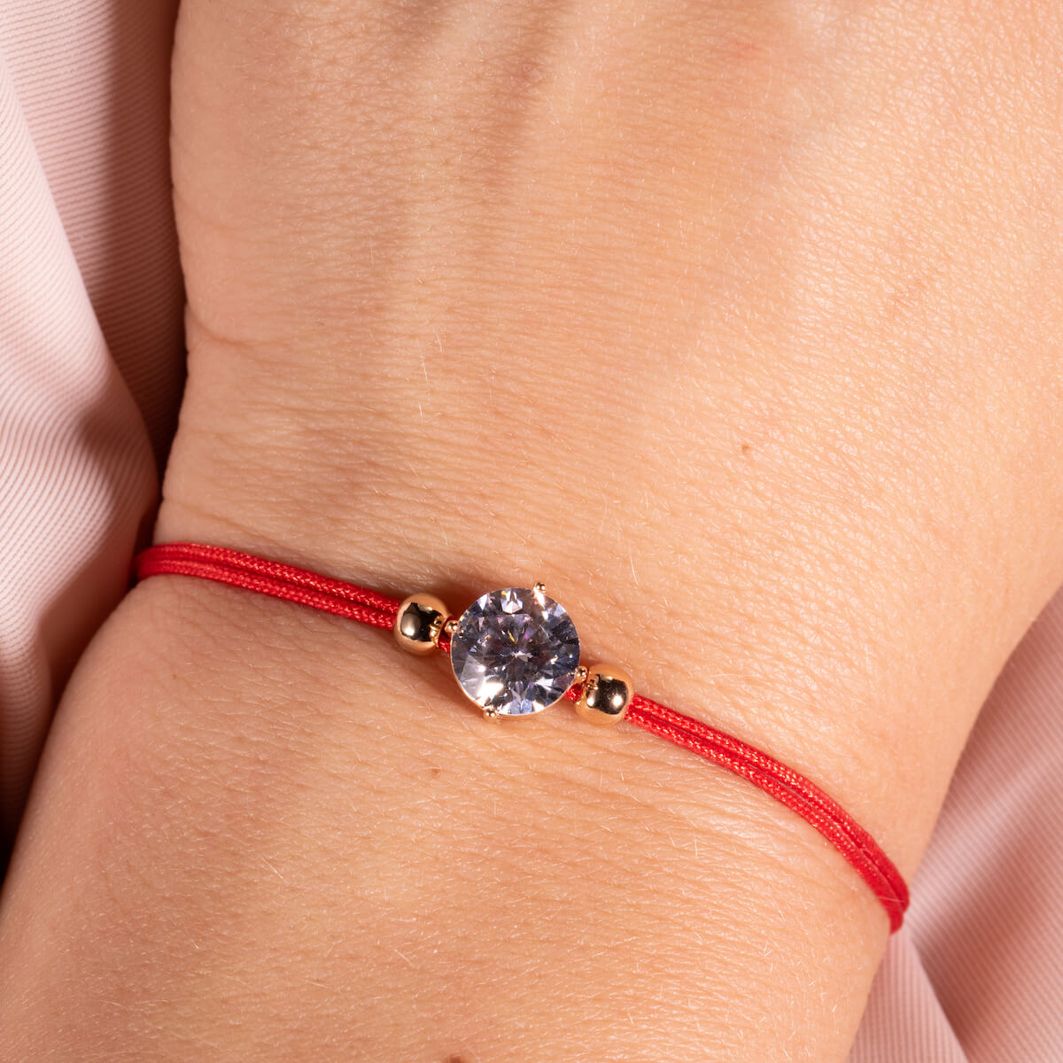 Red protective thread with crystal