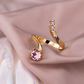 Apzeltīts gredzens ar violēti rozā kristālu